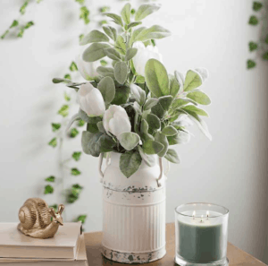 I love vintage milk jugs. They can be used for so many interior design purposes. I love throwing some greenery or cotton blossoms in it and displaying it next to my farmhouse mantel.