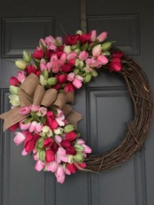 pink, green hot pink, light pink tulips on twig wreath with burlap bow.