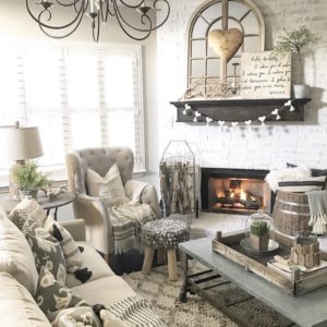 White painted brick and white couch with gray accent chair.